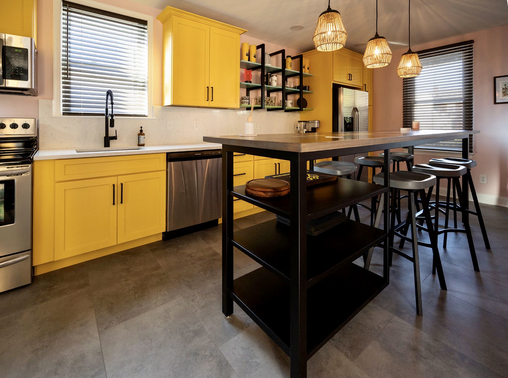 custom island and yellow cabinets